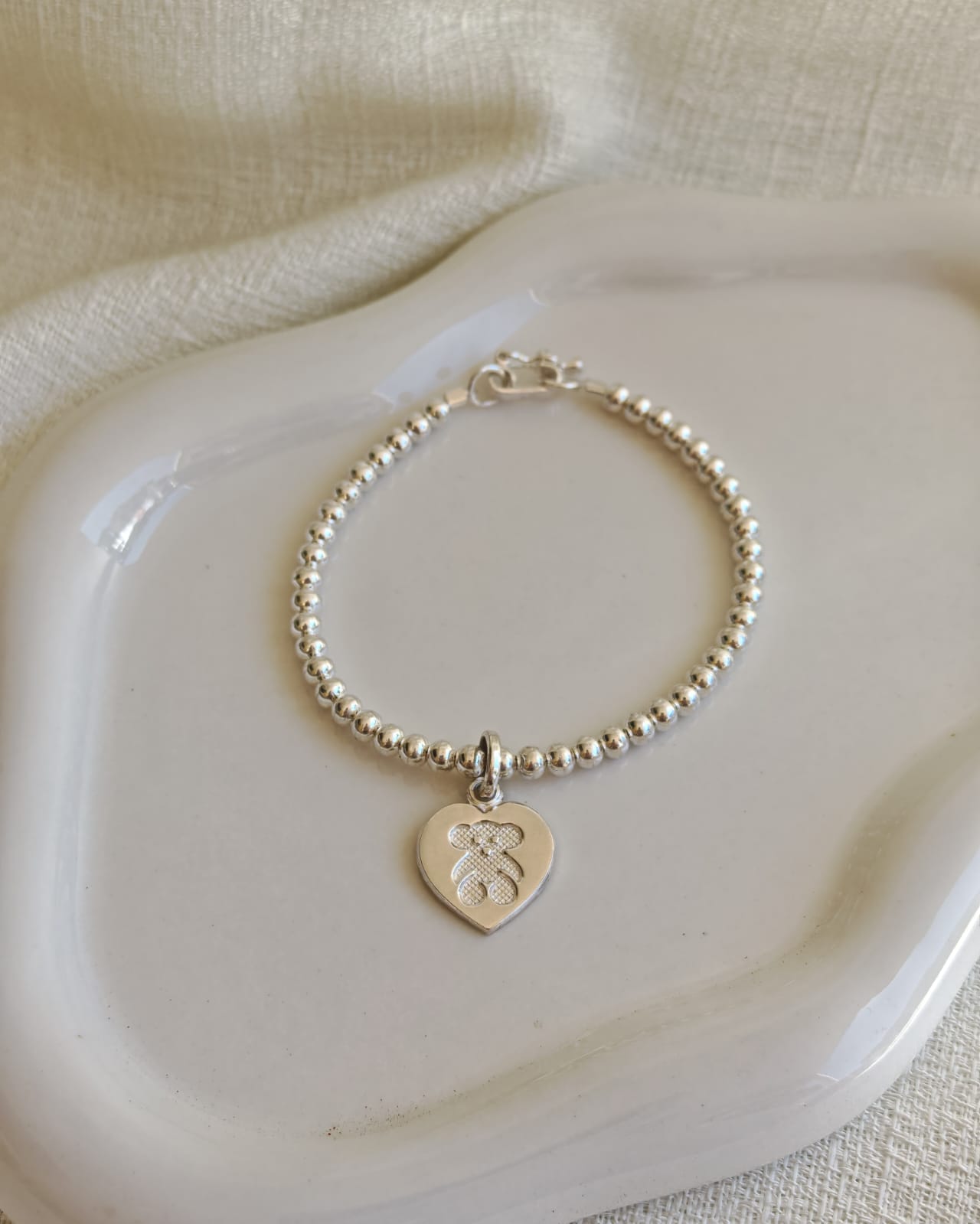 Pulsera de bolas con dije de corazón Tous